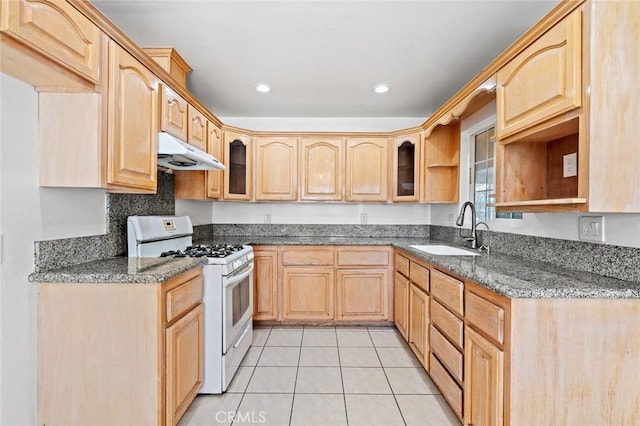 2613 Millbrae Ave, Duarte, CA 91010 - kitchen with white range with gas stovetop, a sink, under cabinet range hood, light tile patterned floors, and glass insert cabinets
