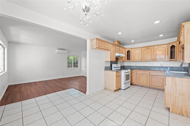 2613 Millbrae Ave, Duarte, CA 91010 - kitchen with white range with gas stovetop, under cabinet range hood, a sink, a wall mounted air conditioner, and glass insert cabinets
