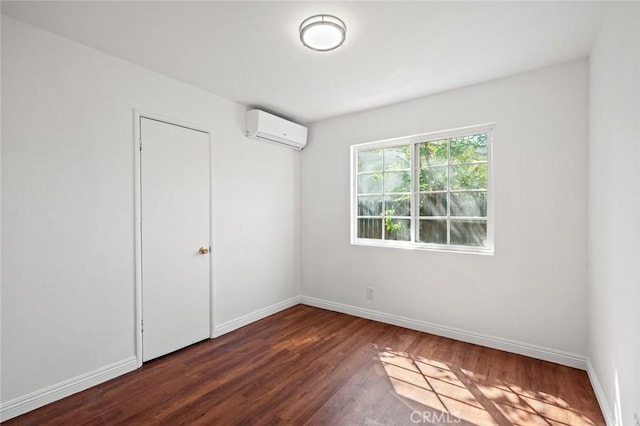 2613 Millbrae Ave, Duarte, CA 91010 - empty room featuring a wall mounted AC, wood finished floors, and baseboards