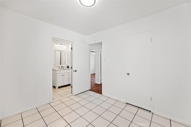 2613 Millbrae Ave, Duarte, CA 91010 - unfurnished bedroom with a sink, light tile patterned floors, baseboards, and a closet