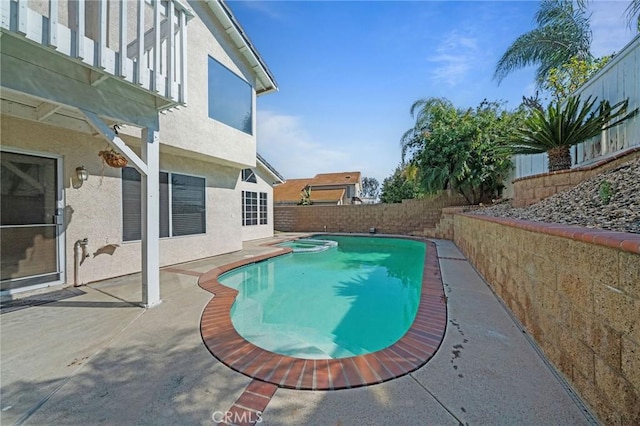 10059 Rock Hl, Moreno Valley, CA 92557 - view of swimming pool featuring a patio area, a pool with connected hot tub, and a fenced backyard