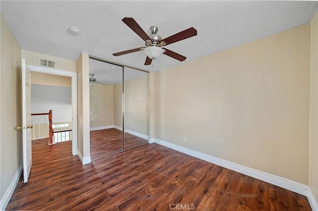 10059 Rock Hl, Moreno Valley, CA 92557 - unfurnished bedroom featuring dark wood finished floors, baseboards, and a closet