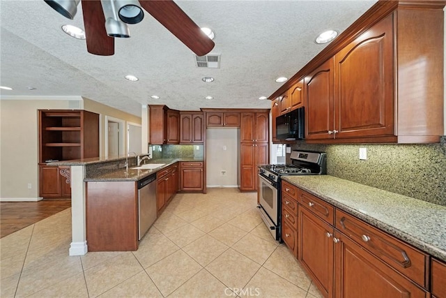 10059 Rock Hl, Moreno Valley, CA 92557 - kitchen featuring stainless steel appliances, a sink, a ceiling fan, a peninsula, and light stone countertops