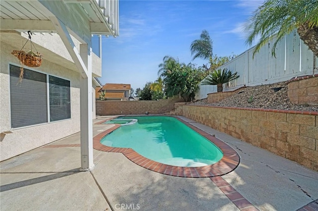 10059 Rock Hl, Moreno Valley, CA 92557 - view of swimming pool with a fenced backyard, a pool with connected hot tub, and a patio area