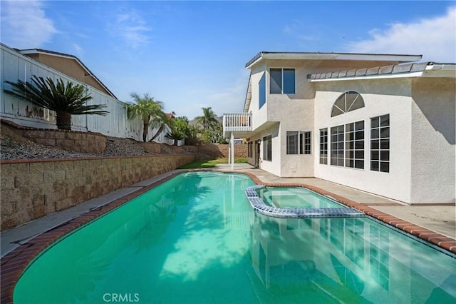 10059 Rock Hl, Moreno Valley, CA 92557 - view of swimming pool with a pool with connected hot tub, a fenced backyard, and a patio area