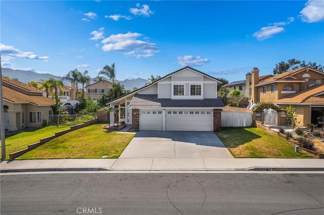 10059 Rock Hl, Moreno Valley, CA 92557 - traditional-style home with a residential view, driveway, an attached garage, brick siding, and a mountain view