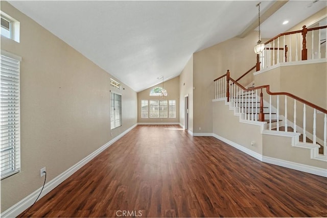 10059 Rock Hl, Moreno Valley, CA 92557 - unfurnished living room featuring wood finished floors, baseboards, and high vaulted ceiling