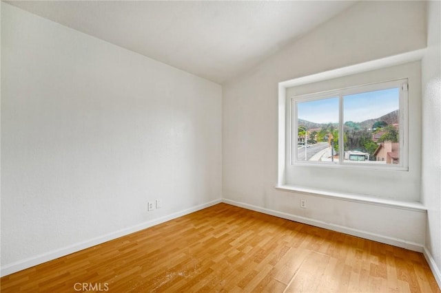 4176 Canyonside Cir, Jurupa Valley, CA 92509 - empty room featuring light wood-type flooring, baseboards, and vaulted ceiling