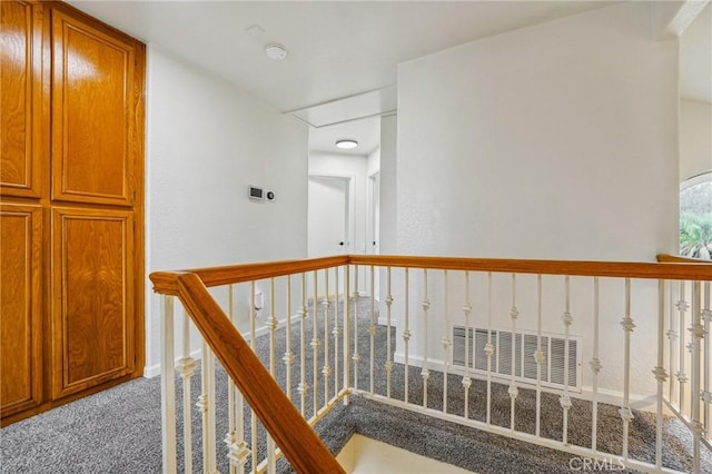 4176 Canyonside Cir, Jurupa Valley, CA 92509 - hallway with carpet floors, an upstairs landing, and attic access