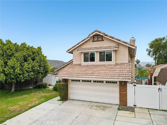 4176 Canyonside Cir, Jurupa Valley, CA 92509 - view of front of house with driveway, an attached garage, brick siding, a tile roof, and a chimney