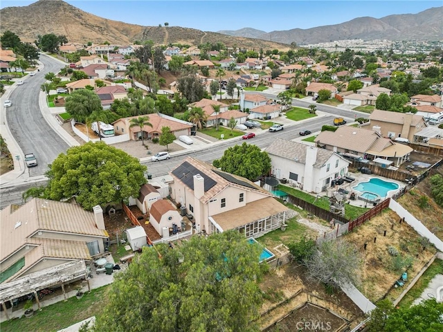4176 Canyonside Cir, Jurupa Valley, CA 92509 - aerial view of residential area with a mountainous background and a pool
