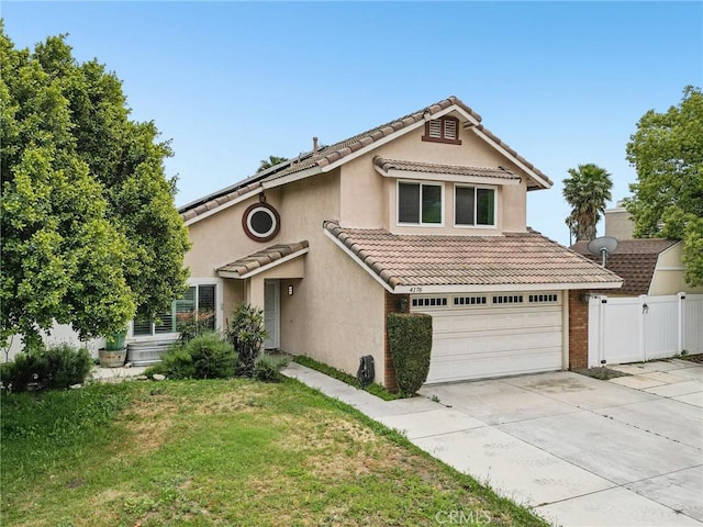4176 Canyonside Cir, Jurupa Valley, CA 92509 - view of front facade with concrete driveway, a garage, a tiled roof, and stucco siding