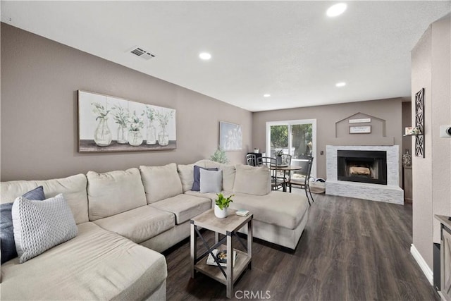 1992 Moonbeam Cir, Upland, CA 91784 - living room featuring dark wood-style floors, a fireplace with raised hearth, recessed lighting, and baseboards