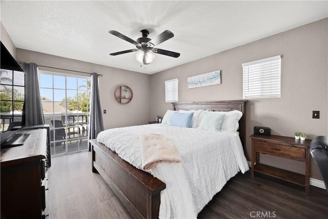 bedroom featuring access to outside, wood finished floors, and a ceiling fan