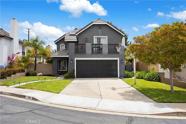 view of front of home featuring a balcony, stucco siding, an attached garage, concrete driveway, and a tiled roof