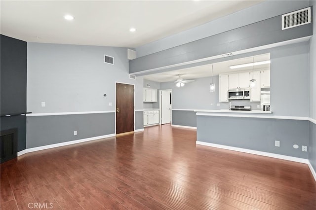unfurnished living room featuring dark wood-style flooring, a ceiling fan, baseboards, and recessed lighting