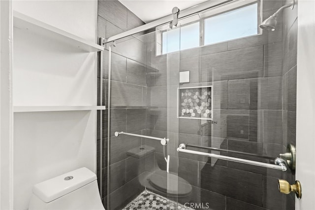 full bathroom featuring toilet and a stall shower