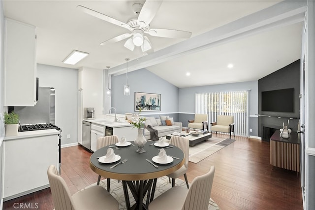 dining room with ceiling fan, dark wood-style flooring, and baseboards