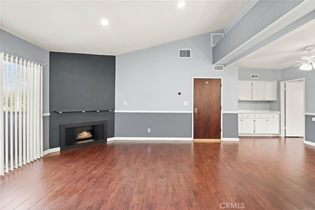 unfurnished living room with ceiling fan, dark wood-type flooring, a large fireplace, baseboards, and recessed lighting