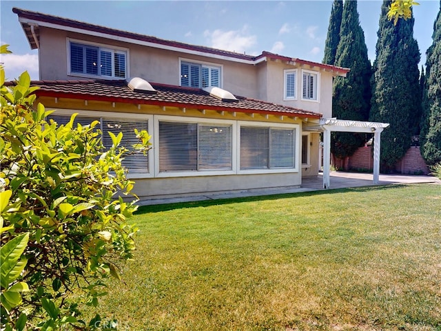 10531 Angel Ave, Fountain Valley, CA 92708 - back of house with a pergola, a patio area, stucco siding, a yard, and a carport