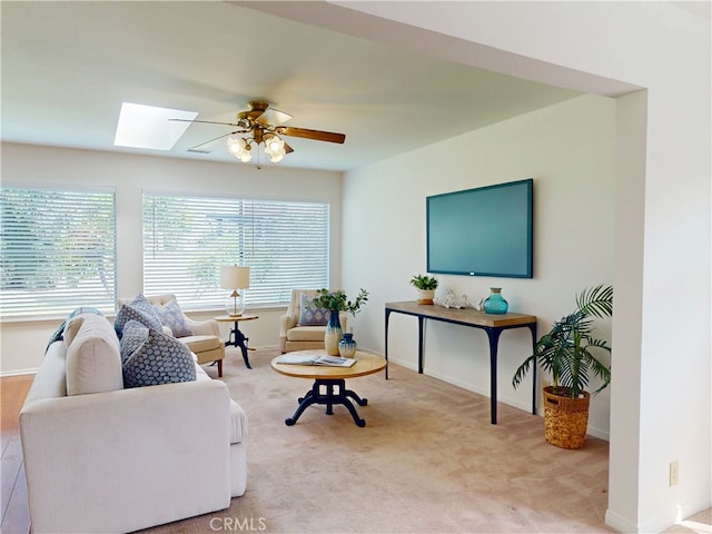 10531 Angel Ave, Fountain Valley, CA 92708 - living room with a ceiling fan, a skylight, light carpet, and baseboards