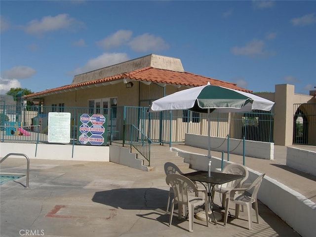 10531 Angel Ave, Fountain Valley, CA 92708 - rear view of house featuring fence, a patio area, and stucco siding