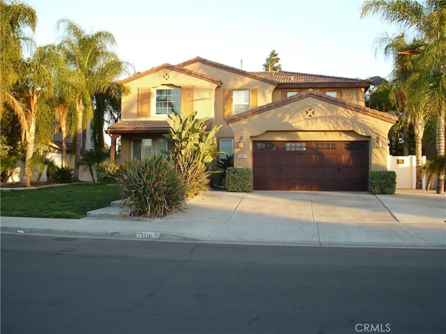 1110 Laurelhurst, San Jacinto, CA 92582 - mediterranean / spanish home featuring a tile roof, concrete driveway, a garage, and stucco siding