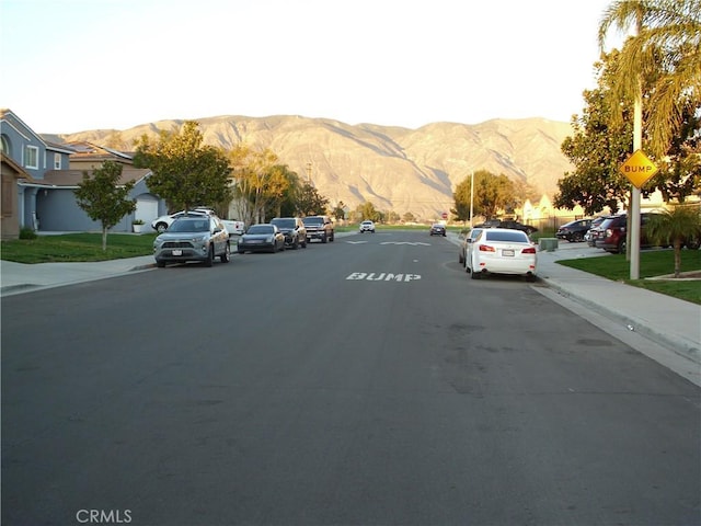 1110 Laurelhurst, San Jacinto, CA 92582 - view of asphalt street featuring sidewalks, a mountain view, and curbs