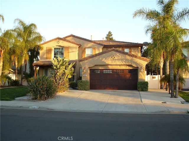 1110 Laurelhurst, San Jacinto, CA 92582 - mediterranean / spanish house with a garage, concrete driveway, stucco siding, and a tile roof