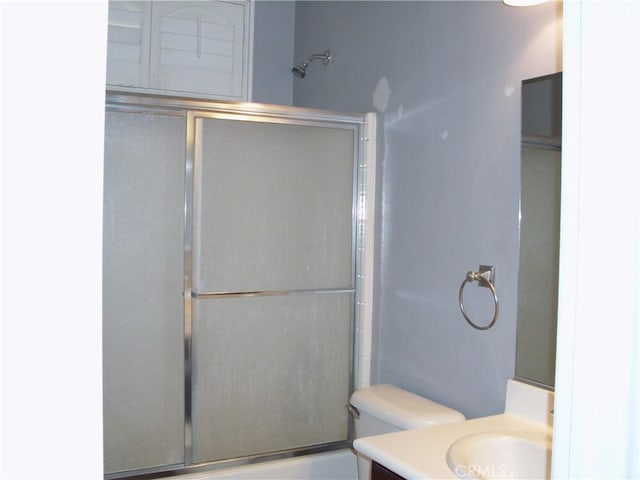 1110 Laurelhurst, San Jacinto, CA 92582 - full bath featuring vanity, shower / bath combination with glass door, and toilet