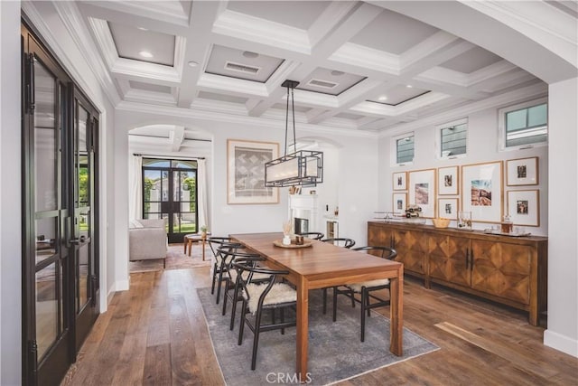 717 35th St, Manhattan Beach, CA 90266 - dining space with arched walkways, dark wood-type flooring, beamed ceiling, coffered ceiling, and ornamental molding