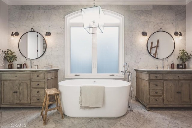 717 35th St, Manhattan Beach, CA 90266 - full bathroom featuring marble finish flooring, two vanities, a soaking tub, and tile walls