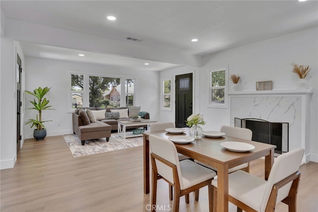 1925 N Marengo Ave, Pasadena, CA 91103 - dining room featuring light wood-type flooring, recessed lighting, healthy amount of natural light, a premium fireplace, and baseboards