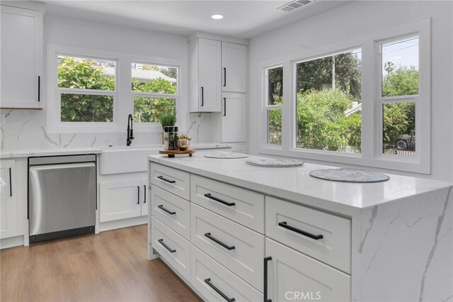 1925 N Marengo Ave, Pasadena, CA 91103 - kitchen with stainless steel dishwasher, a sink, healthy amount of natural light, white cabinetry, and recessed lighting