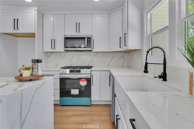1925 N Marengo Ave, Pasadena, CA 91103 - kitchen featuring stainless steel appliances, white cabinetry, backsplash, a sink, and recessed lighting