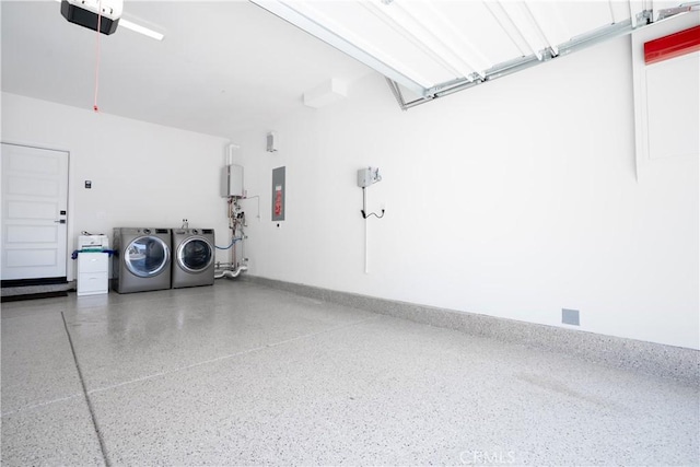612 Prickly Pear Way, Rancho Mission Viejo, CA 92694 - garage featuring washer and clothes dryer, a garage door opener, electric panel, and baseboards