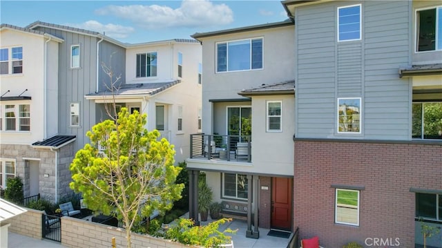612 Prickly Pear Way, Rancho Mission Viejo, CA 92694 - view of property with stucco siding, a balcony, and brick siding