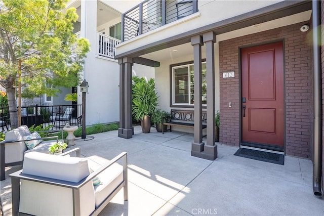 612 Prickly Pear Way, Rancho Mission Viejo, CA 92694 - view of exterior entry with brick siding, stucco siding, and fence