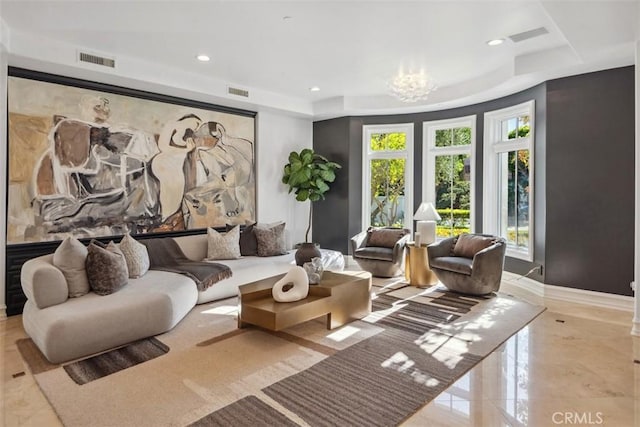 28 Shoreridge, Newport Coast, CA 92657 - living area featuring a raised ceiling, a chandelier, recessed lighting, and marble tiled floors