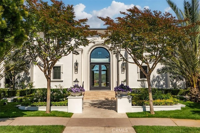 28 Shoreridge, Newport Coast, CA 92657 - view of front of house featuring french doors and stucco siding
