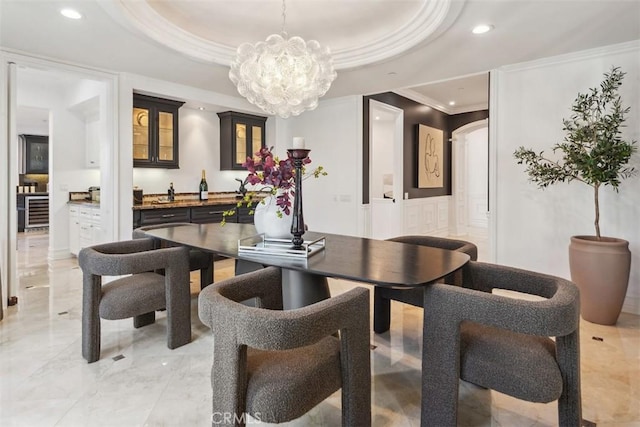 28 Shoreridge, Newport Coast, CA 92657 - dining space featuring crown molding, arched walkways, recessed lighting, a chandelier, and wine cooler