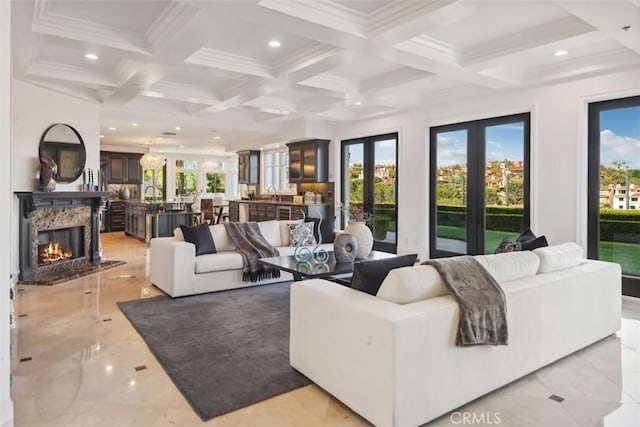 28 Shoreridge, Newport Coast, CA 92657 - living room with coffered ceiling, healthy amount of natural light, beam ceiling, a fireplace, and recessed lighting