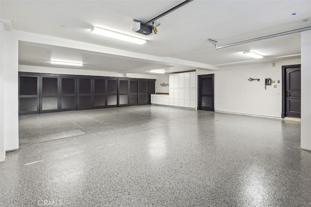 28 Shoreridge, Newport Coast, CA 92657 - garage with a garage door opener and baseboards