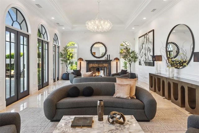 28 Shoreridge, Newport Coast, CA 92657 - living room with a chandelier, recessed lighting, ornamental molding, a fireplace, and french doors