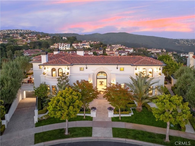 28 Shoreridge, Newport Coast, CA 92657 - mediterranean / spanish house with a chimney, a mountain view, stucco siding, a balcony, and a tile roof