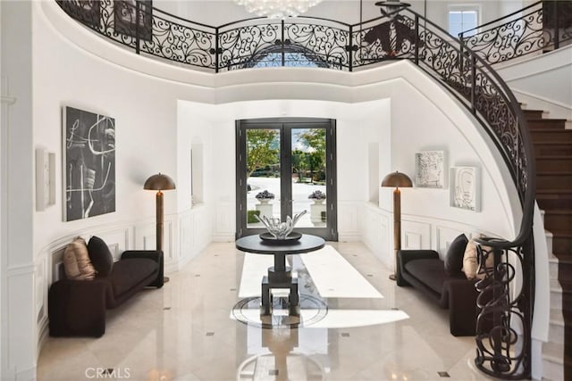 28 Shoreridge, Newport Coast, CA 92657 - foyer with a decorative wall, french doors, plenty of natural light, a towering ceiling, and stairway