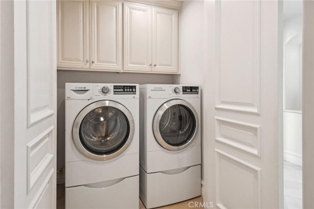 28 Shoreridge, Newport Coast, CA 92657 - washroom with washer and clothes dryer and cabinet space