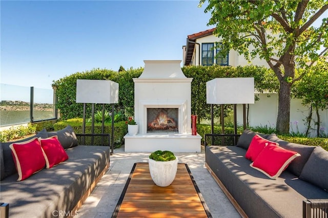 28 Shoreridge, Newport Coast, CA 92657 - view of patio / terrace with an outdoor living space with a fireplace