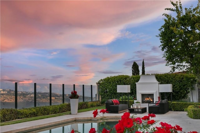 28 Shoreridge, Newport Coast, CA 92657 - outdoor pool with a patio area and an outdoor living space with a fireplace
