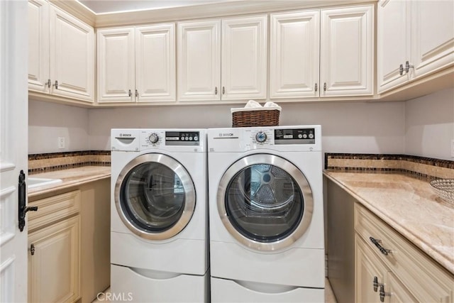 28 Shoreridge, Newport Coast, CA 92657 - laundry room featuring cabinet space and washing machine and clothes dryer